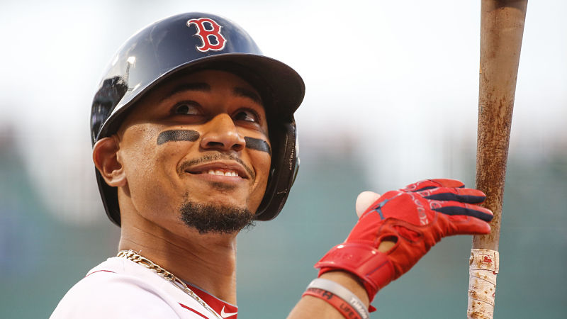 Mookie Betts smiling with a bat