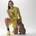 Former WNBA MVP Breanna Stewart poses for a photo with her dog Spicy